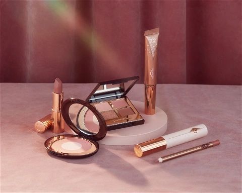 image of various charlotte tilbury makeup products laid out on a surface by Maja Jankowska