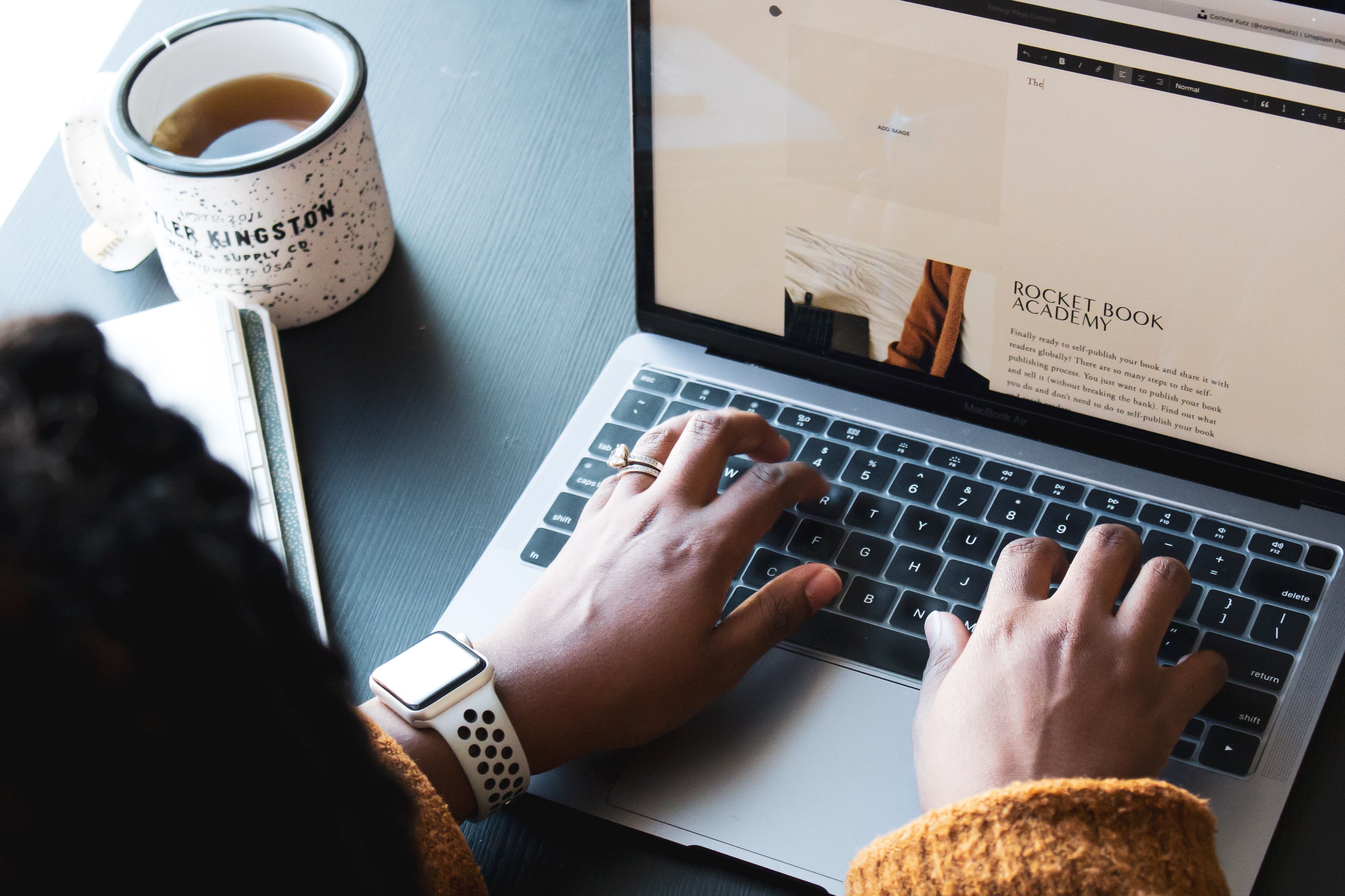 woman typing on laptop