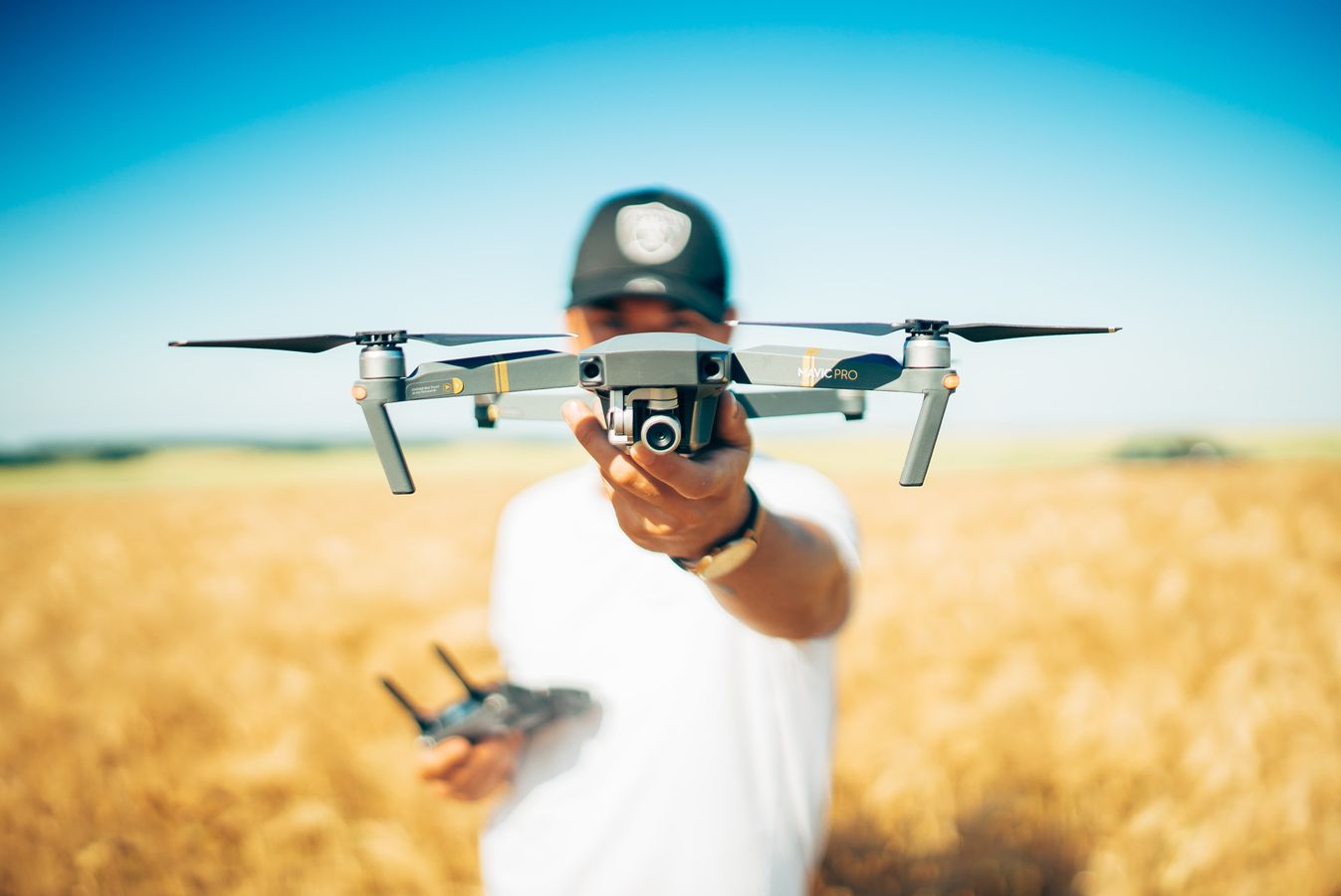 man holding a drone for filming