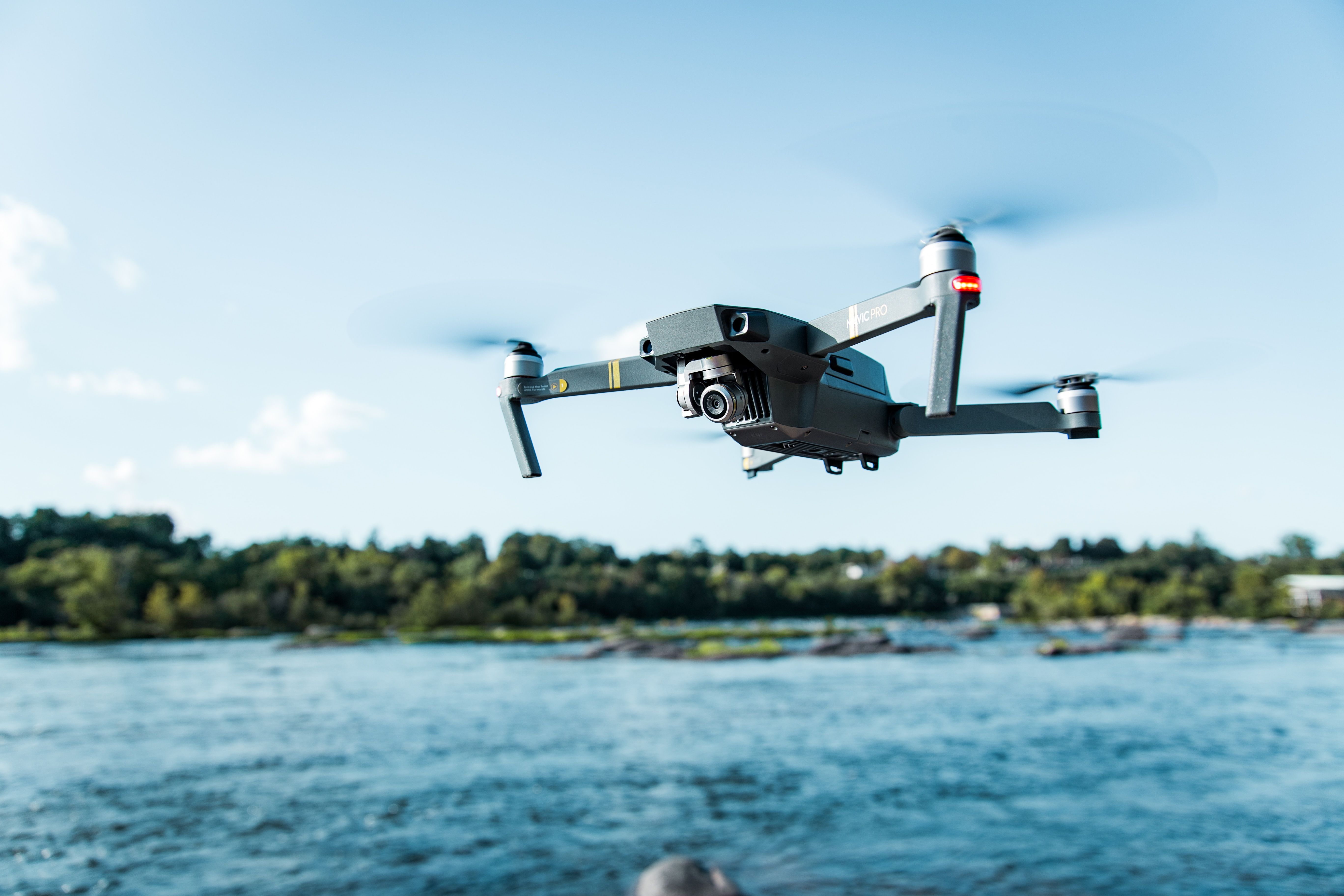 image of a drone flying above a body of water